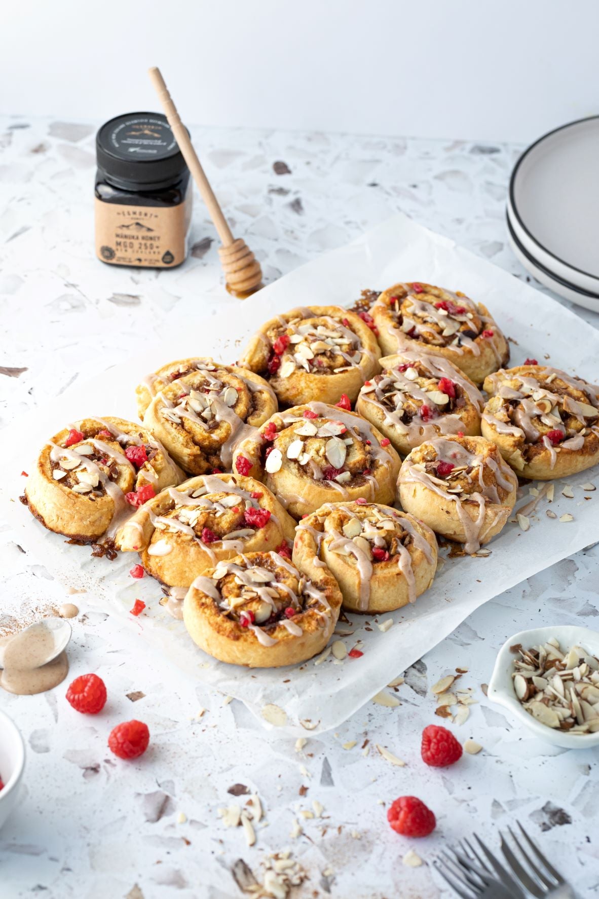 Egmont Honey – Sticky Honey, Raspberry & Almond Cinnamon Buns